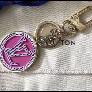Louis Vuitton pink and gold bag charm